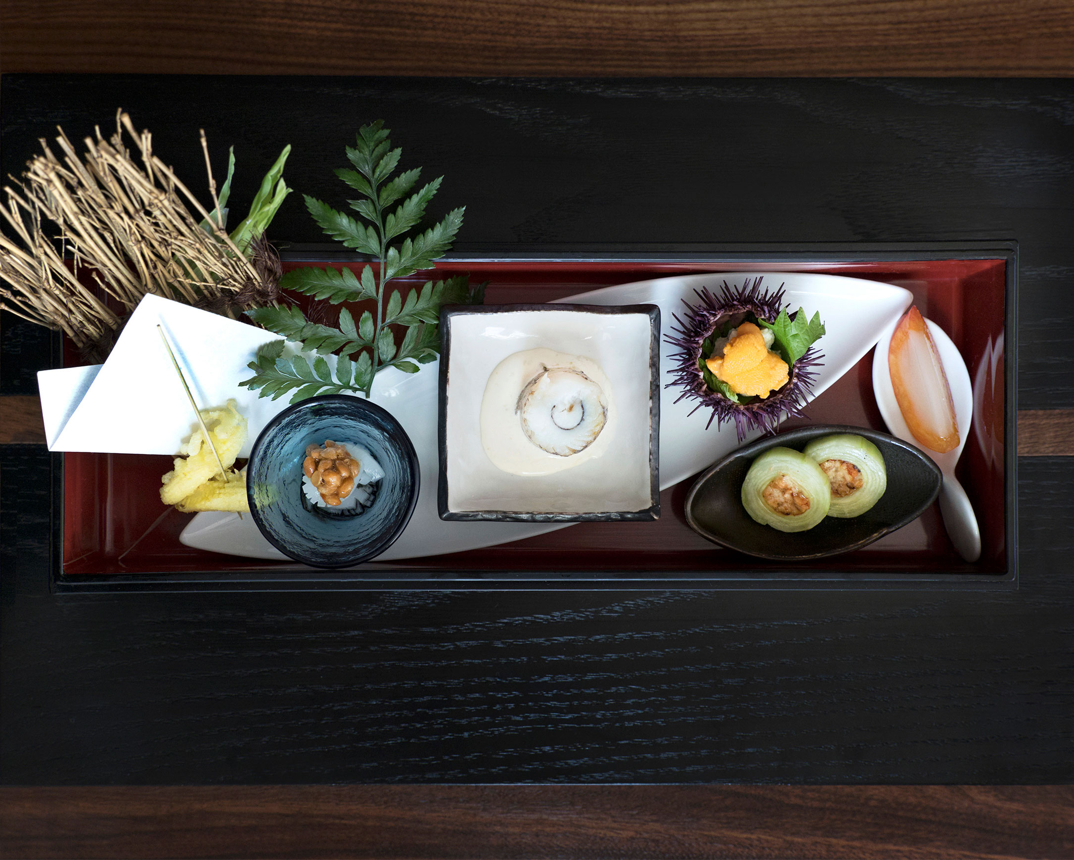 2017 spring zensai box platter with assortment of vegetables, fish, sea urchin, and decorative ceramics