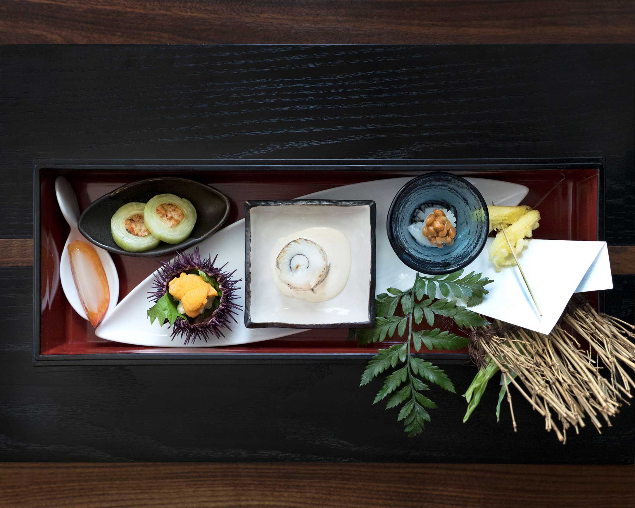 2017 spring zensai box platter with assortment of vegetables, fish, sea urchin, and decorative ceramics